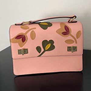 Henri Bendel fold over appliqué bag
